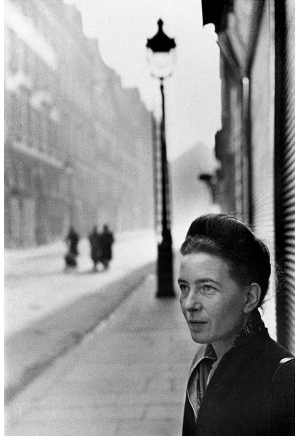 Portrait of the writer Simone de Beauvoir against a Parisian street with a lamp post