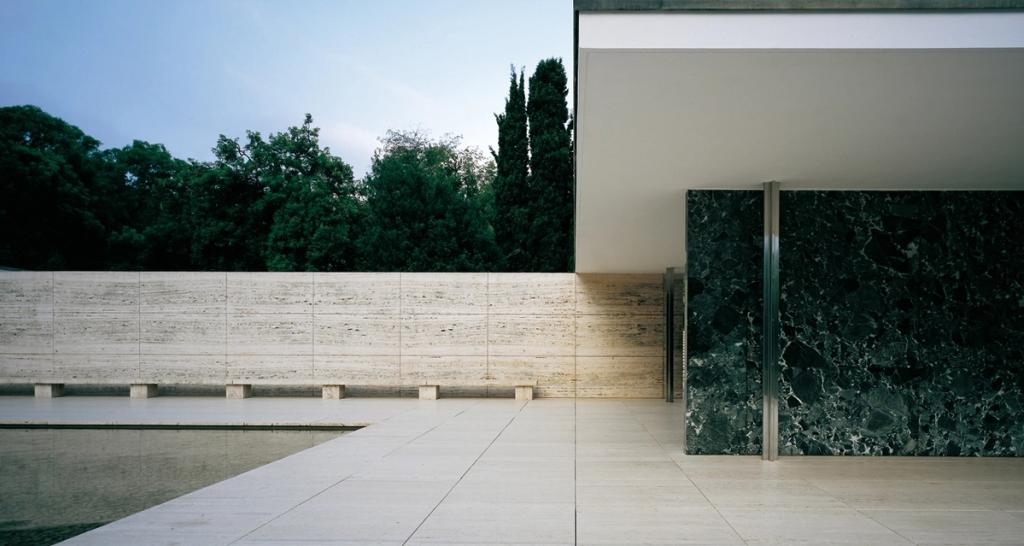 The terrace of the Barcelona Pavilion with its marble wall, pool and reflecting water