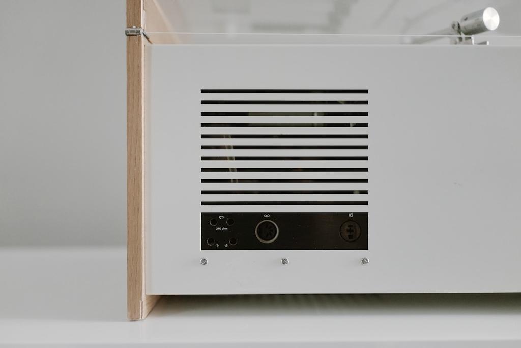 Close-up of the rear speaker grille and connector panel of the Braun SK55