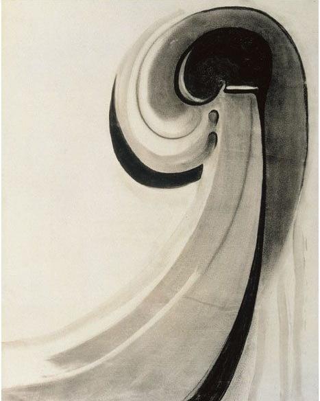 A black-and-white O'Keeffe abstraction featuring a fluid charcoal spiral