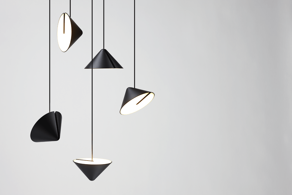 Five black pendant lights with conical and angled shades