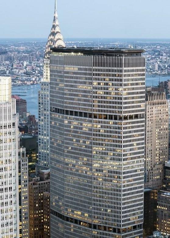 The Pan Am Building tower rising above the Manhattan rooftops, with the Chrysler Building spire in the background
