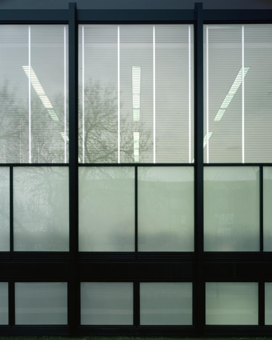 Detail of Crown Hall's glazed façade with opaque and transparent glass panels