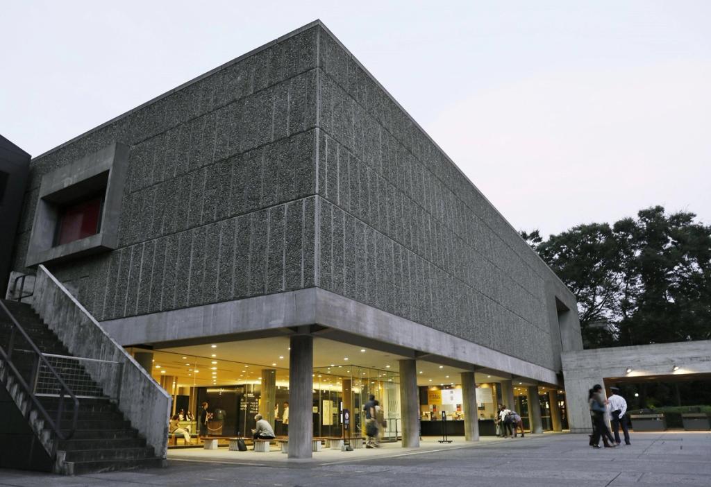 The National Museum of Western Art in Tokyo, the pebble-textured façade on pilotis at dusk