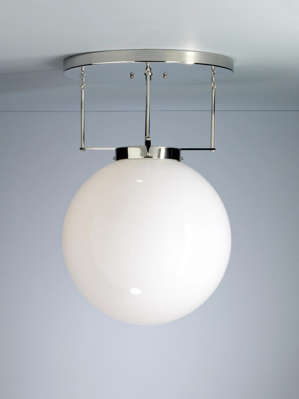 Ceiling light with a white spherical glass shade on a chrome ring