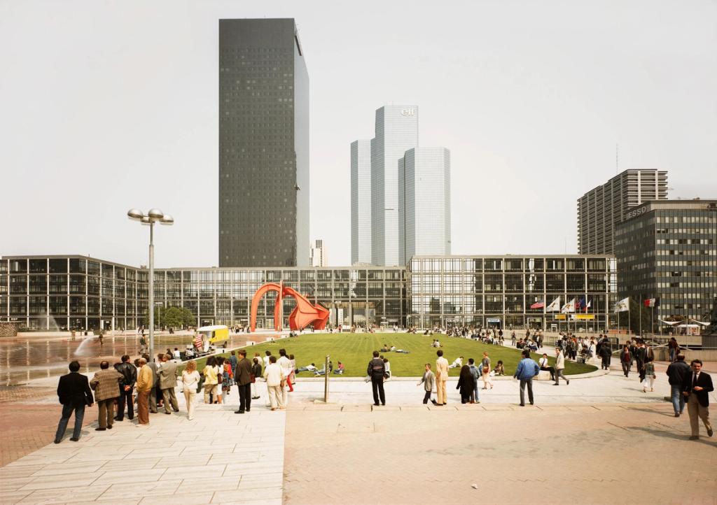 The La Défense business district in Paris, with skyscrapers and people on a landscaped plaza