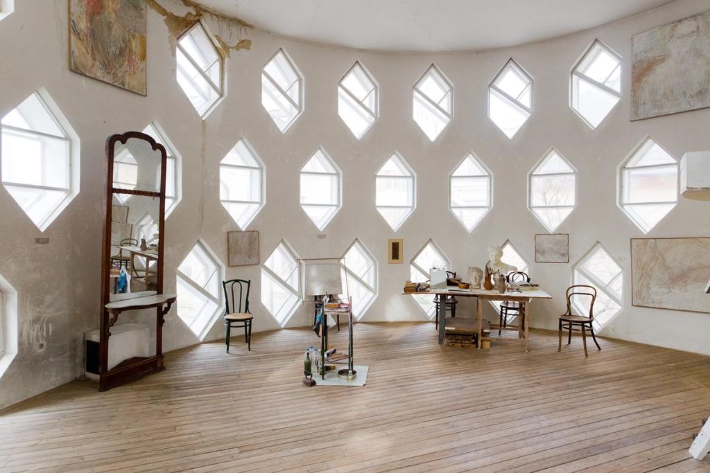 Melnikov's studio with rows of diamond-shaped windows and a wooden floor
