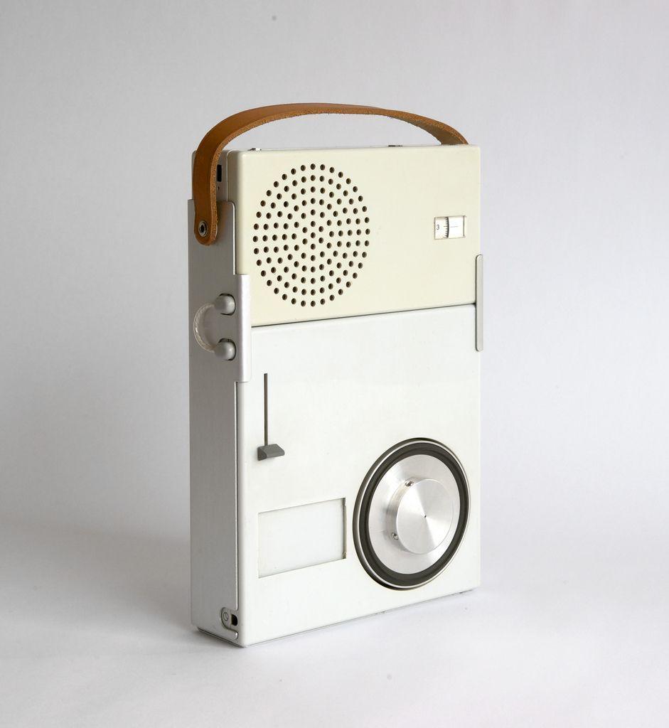 Silver Braun device with a leather carrying strap, rear view on a white background