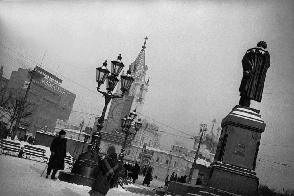 Pushkin Square in winter, with the Pushkin monument and a street lamp photographed from a sharp angle