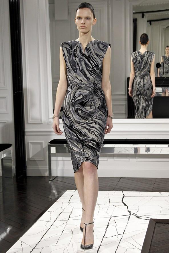 A grey draped Balenciaga dress with an abstract pattern at the show