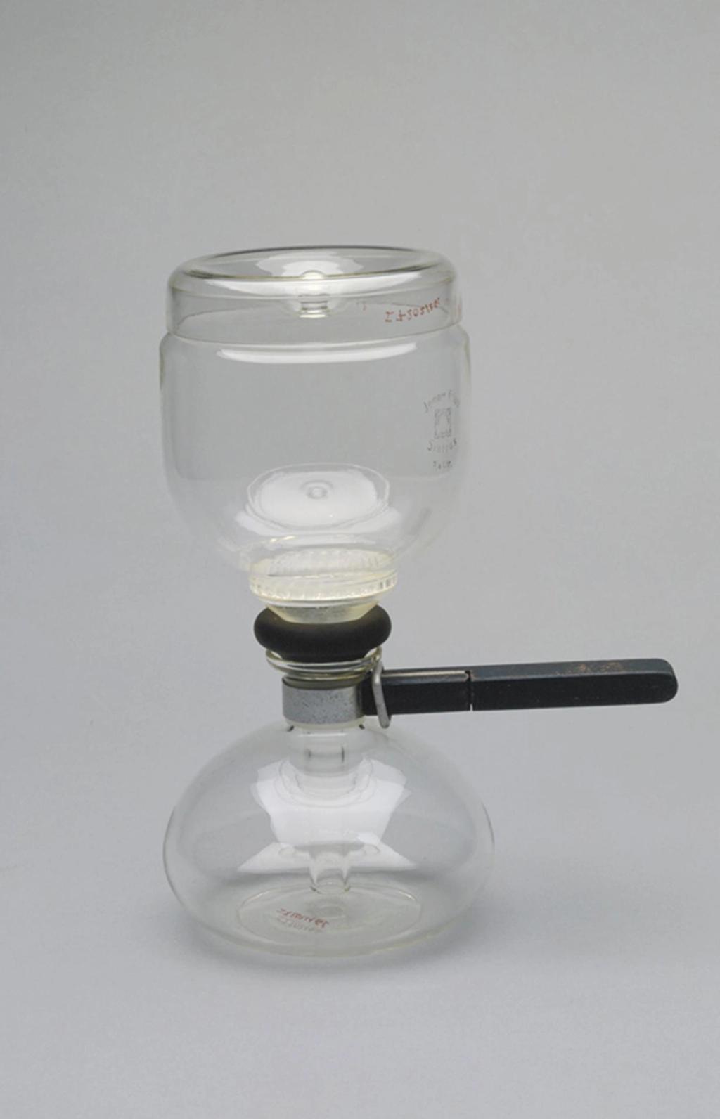 A glass vacuum coffee maker comprising two flasks with a black wooden handle
