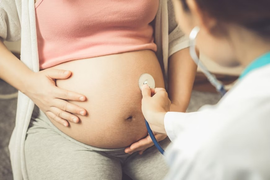 Doctor attending to a preganant woman