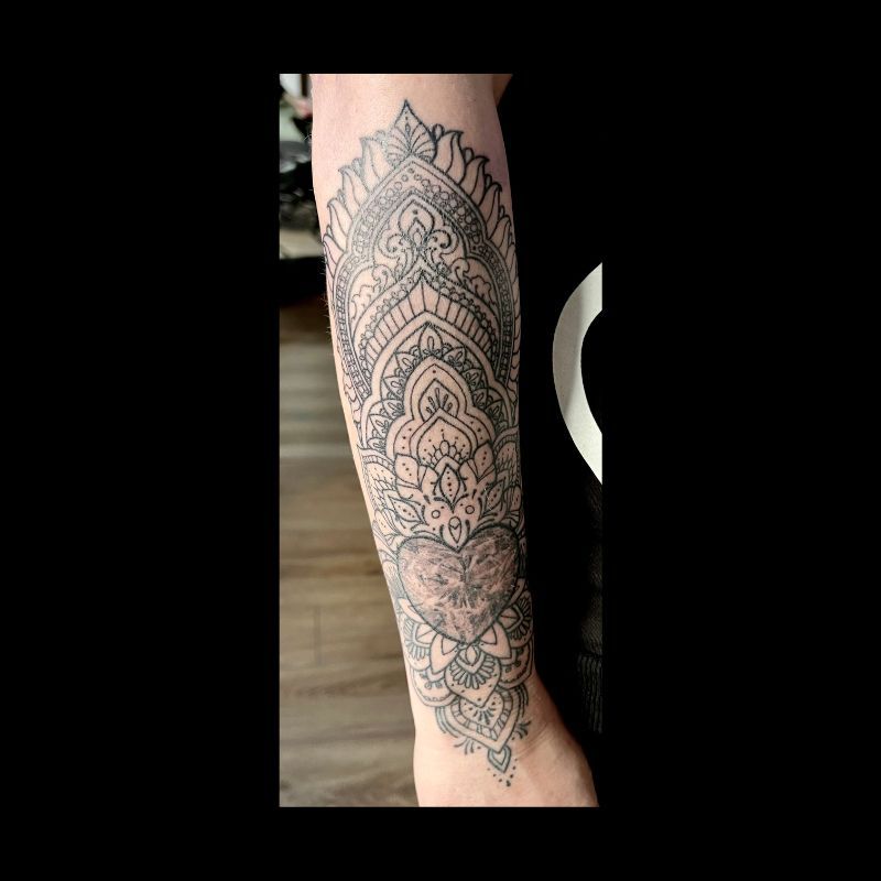 mandala arm tattoo