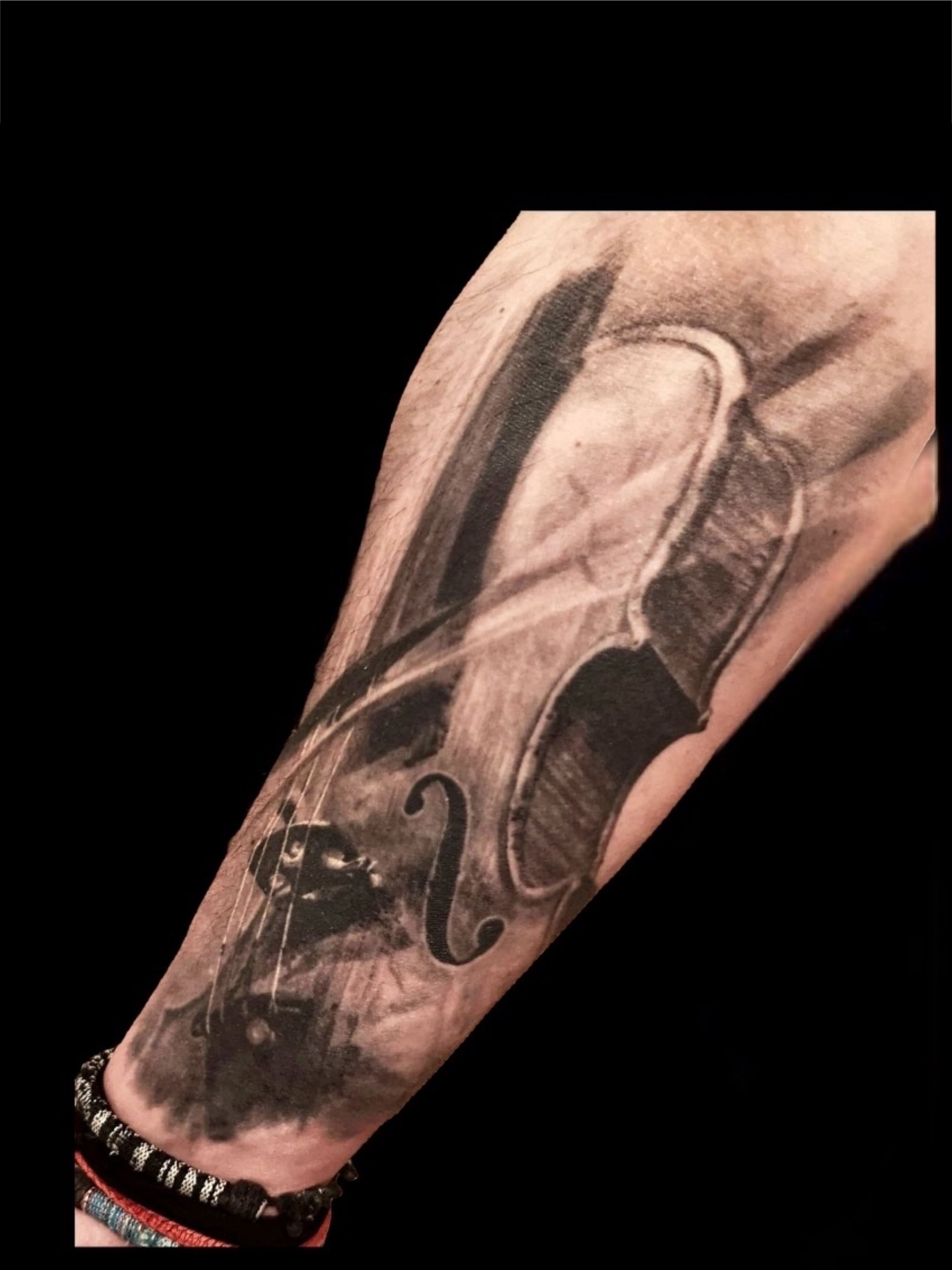 Violin arm tattoo
