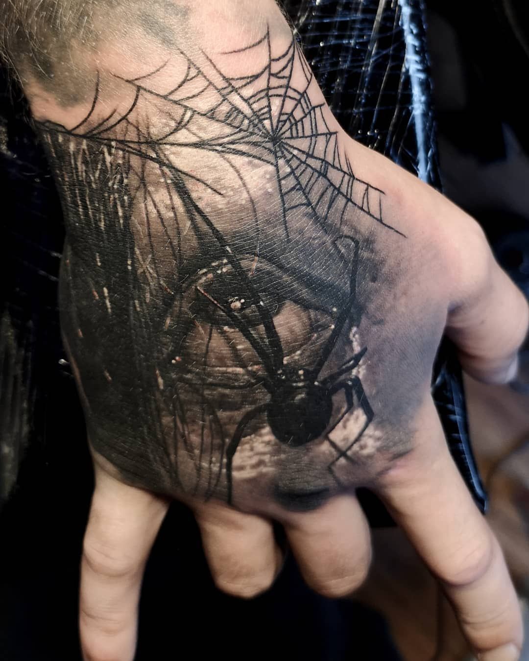 Spider hand tattoo