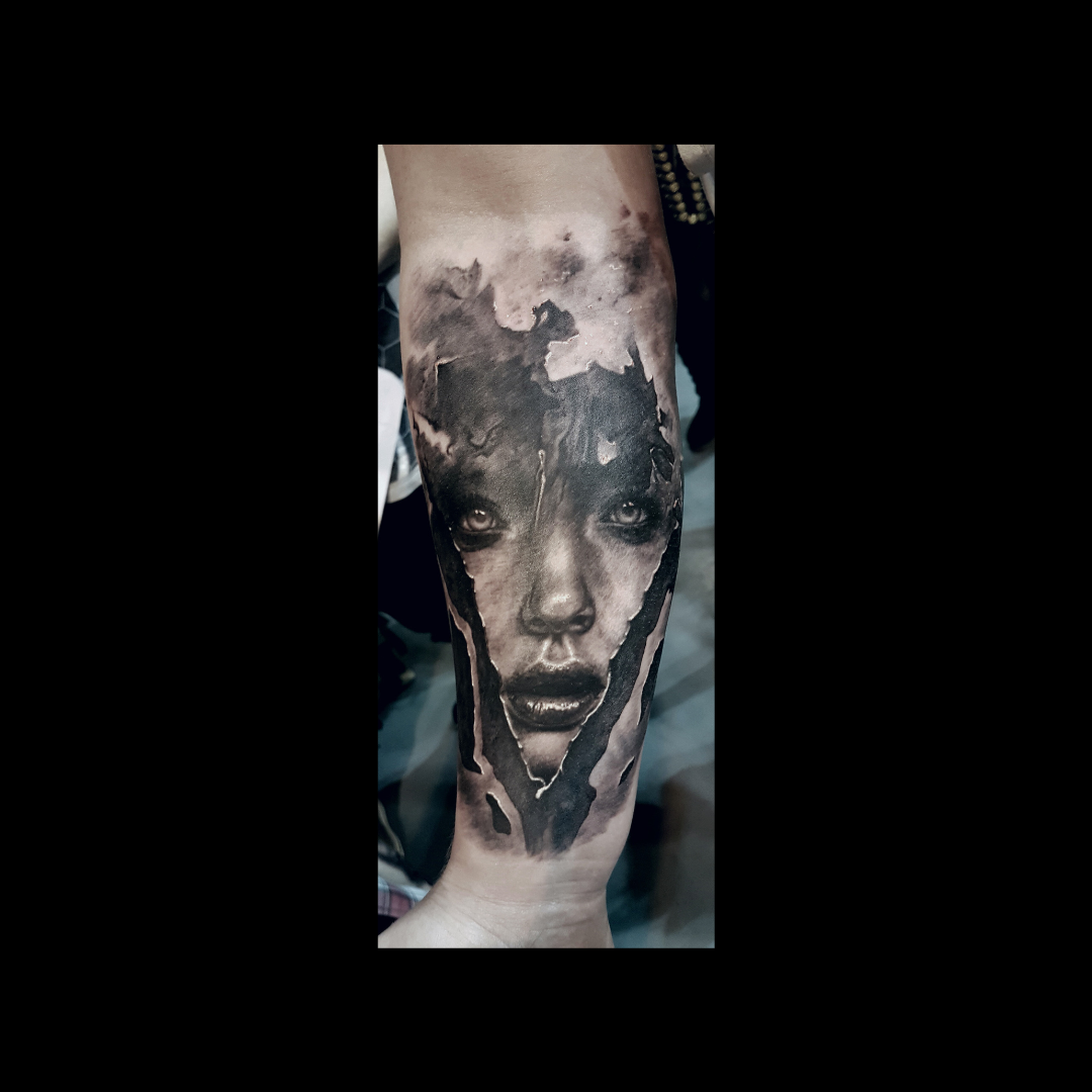 Black & White Women face in triangle Tattoo 2