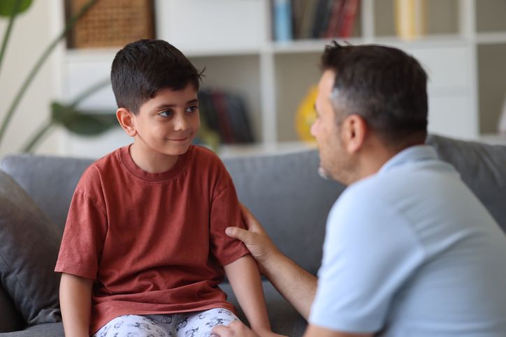 father talking to son
