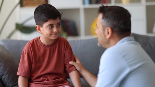 father talking to son