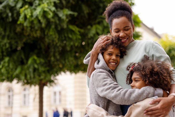 mother and children hugging