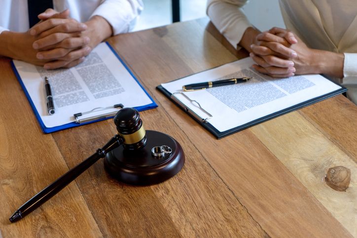 couple in law office about to sign divorce papers