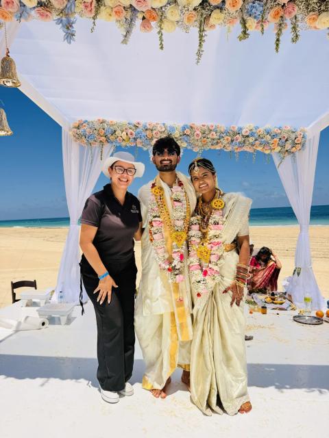 The couple with Grecia at their wedding ceremony — Punta Cana