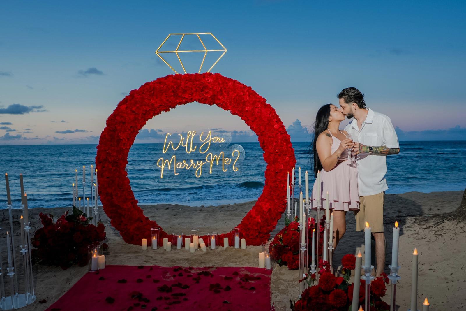 Endless Love: Couple celebrating beside the red ring and illuminated diamond. Endless Love: Couple celebrating beside the red ring and illuminated diamond.