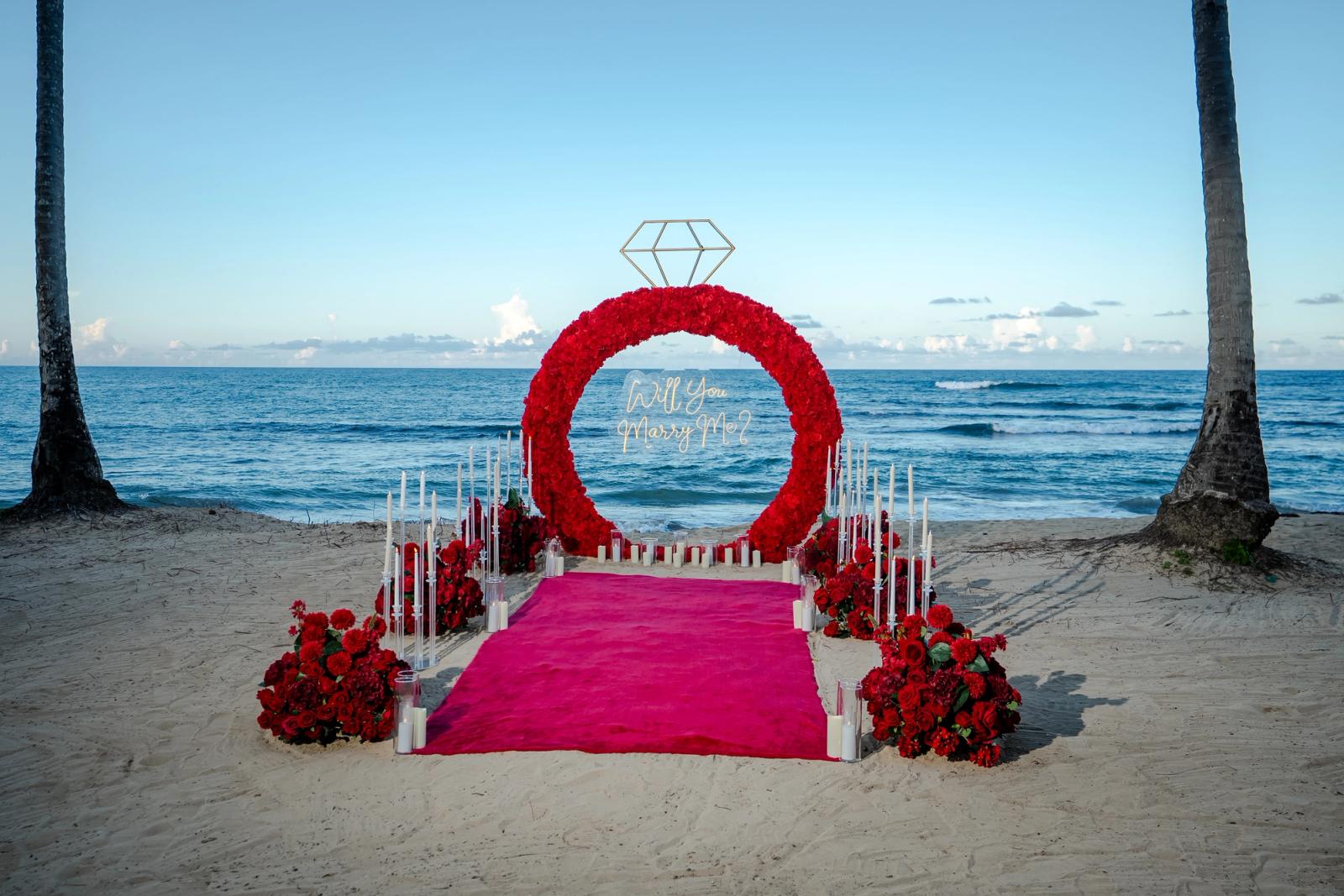 Endless Love: Wide view of the proposal setup between palm trees. Endless Love: Wide view of the proposal setup between palm trees.