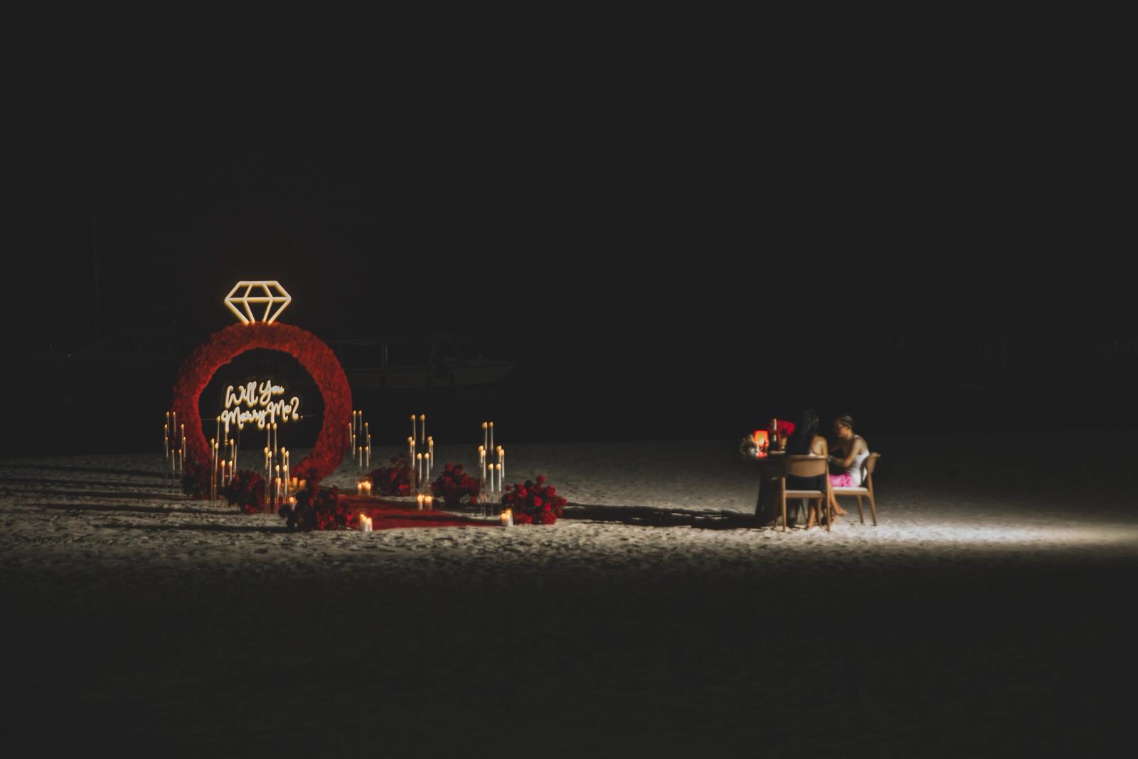 Endless Love: Panoramic nighttime view of the illuminated beach proposal setup. Endless Love: Panoramic nighttime view of the illuminated beach proposal setup.