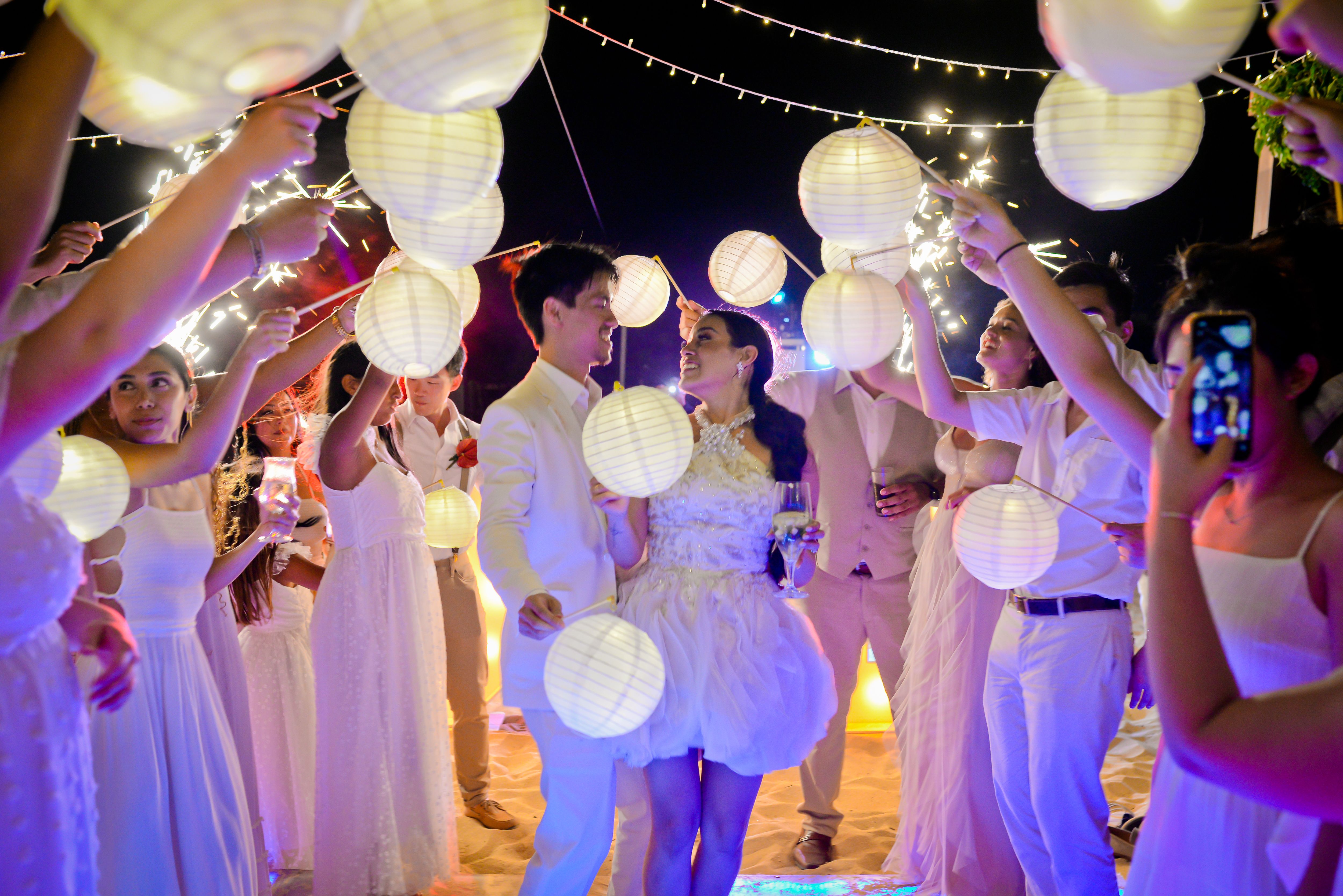 Newlyweds celebrating under lanterns at a Punta Cana destination wedding