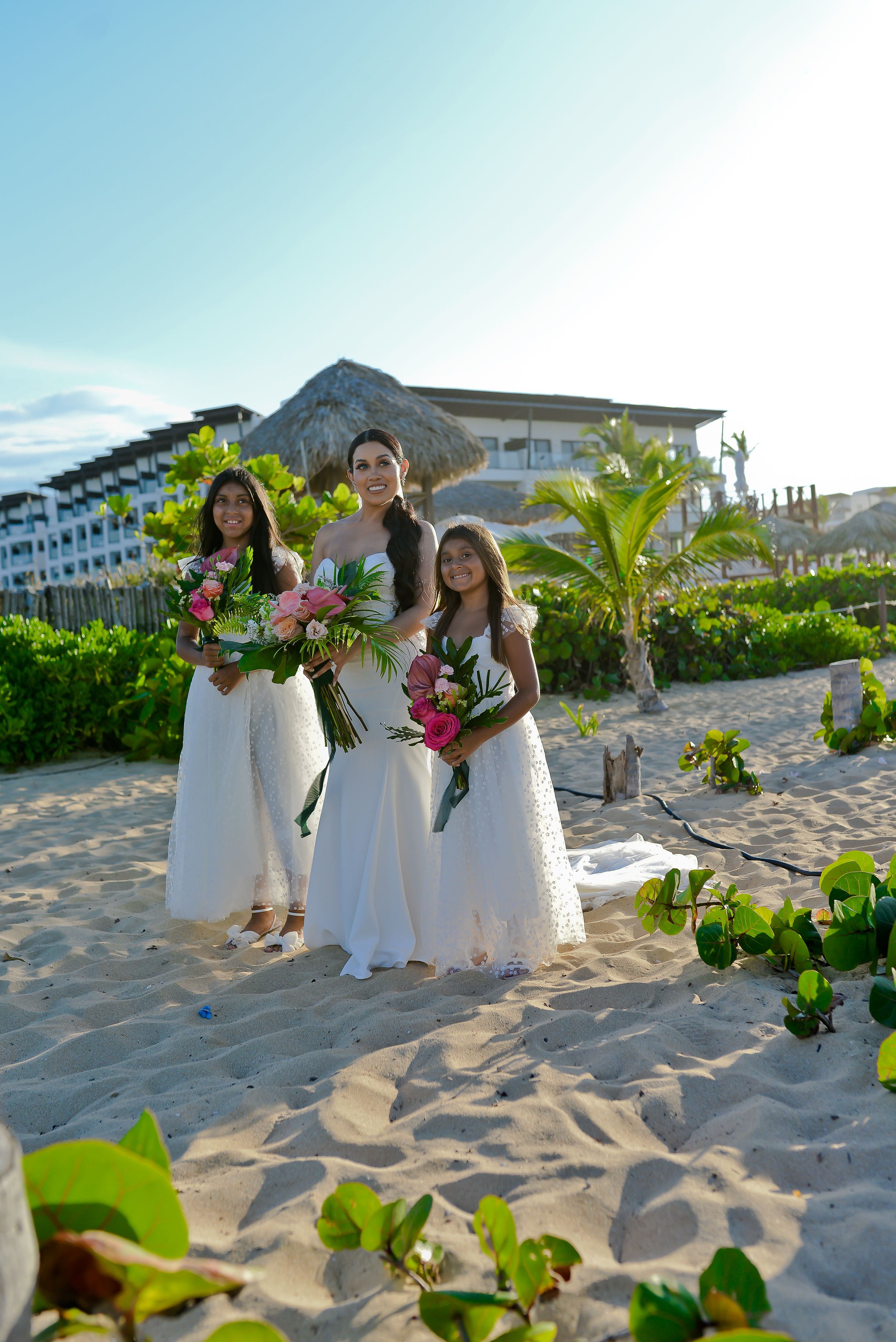 Bride with two flower girls at a Punta Cana beach wedding