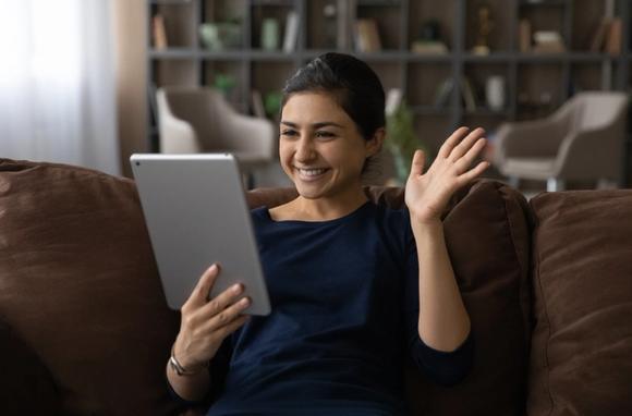 Woman having an online business coaching session on a handheld device
