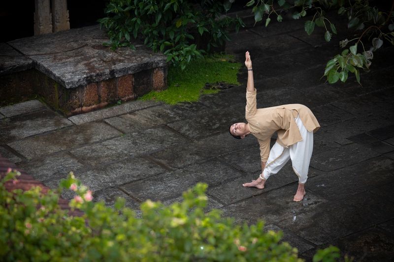 Trikonam triangle geometry inspired by yoga, Devi and asana practice