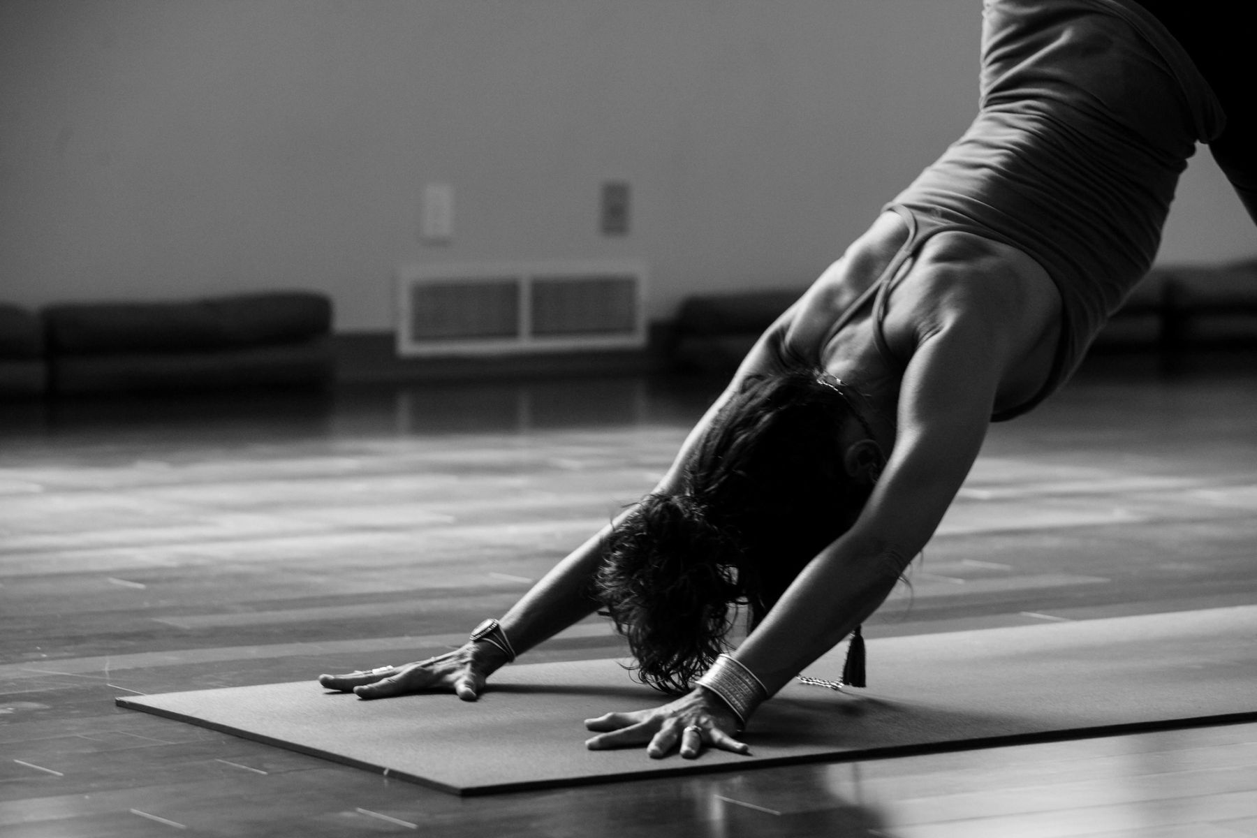 A person practising yoga in a calm and quiet setting