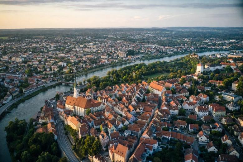 Aerial view of a town with a river and several neighbourhoods