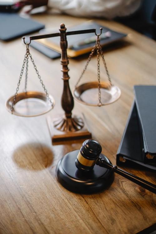 scales and a gavel sitting on a table