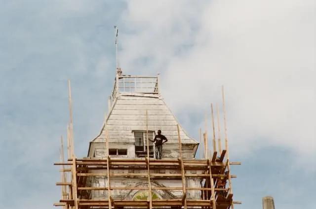 a man standing in a building in stone town, zanzibar