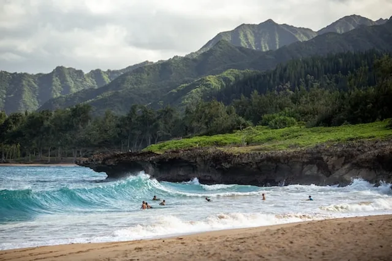 beach in hawaii with surfers