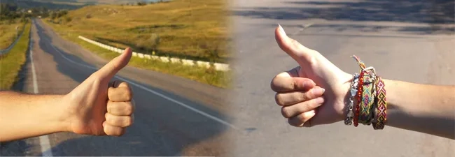 Hand of hiker man at rural mountain road. Daybreak.
