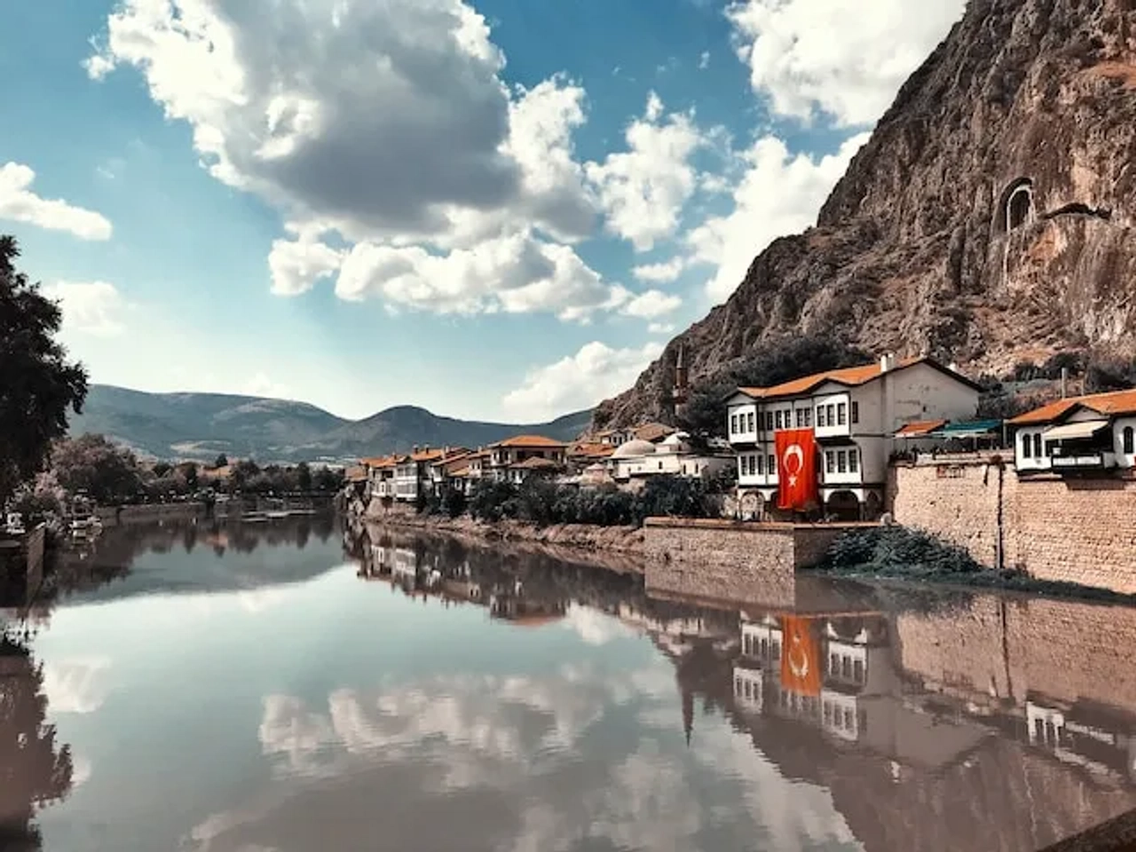 hpuse with a turkey flag near a river in turkey