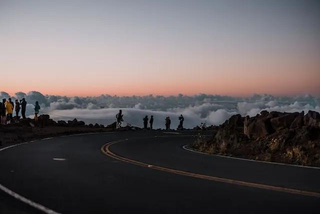 people watching the sunrise in Haleakala National Park in Maui
