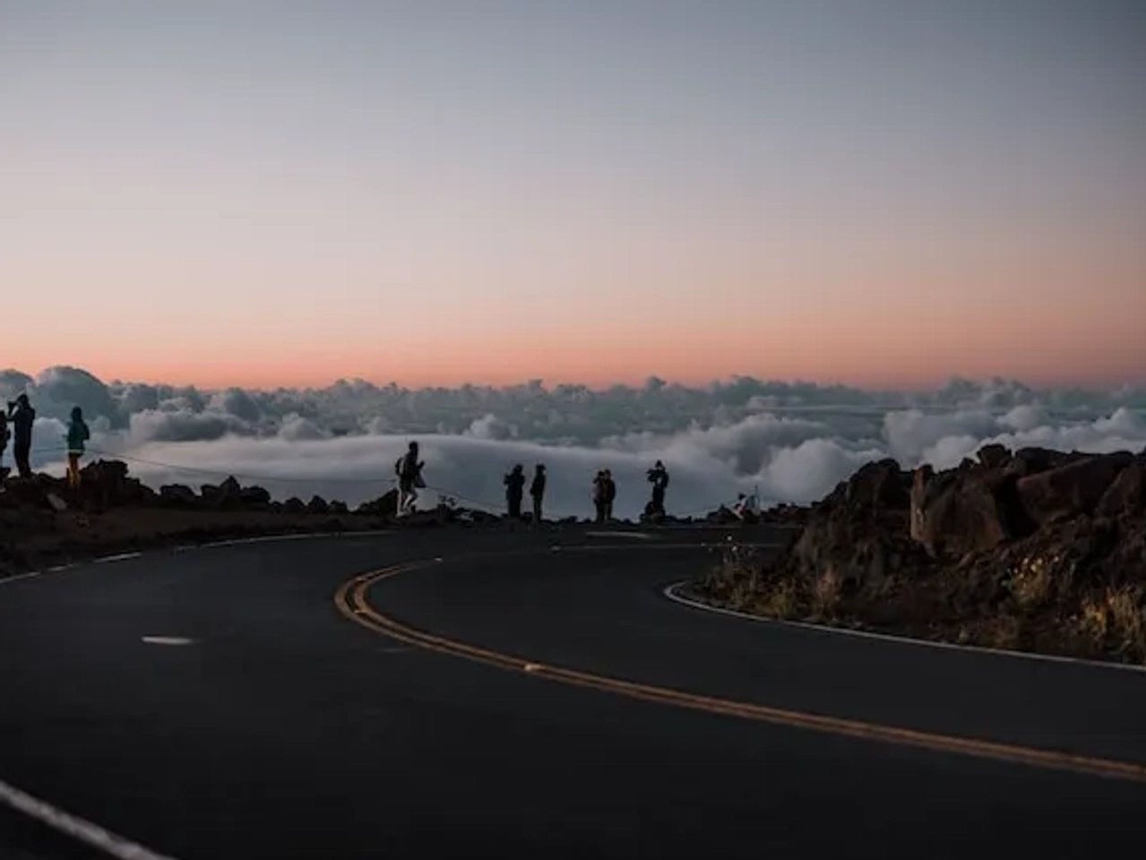 people watching the sunrise in Haleakala National Park in Maui
