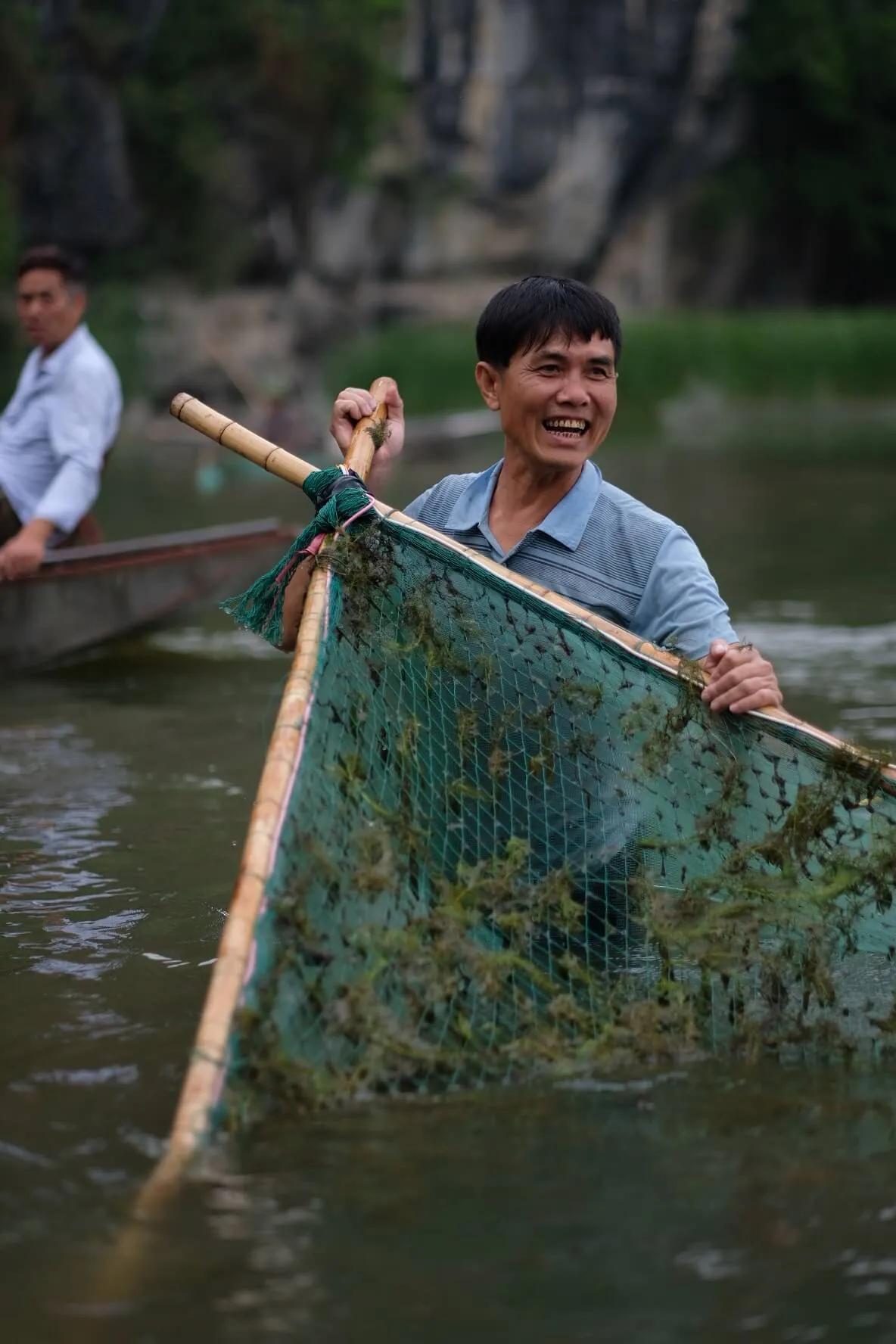 pescador no rio tam coc