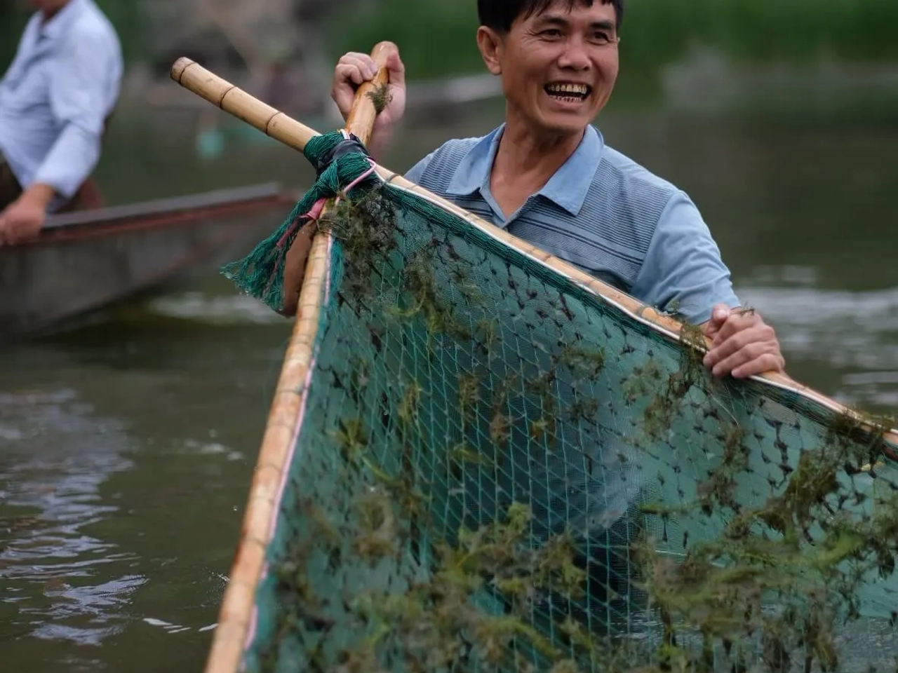 pescador no rio tam coc