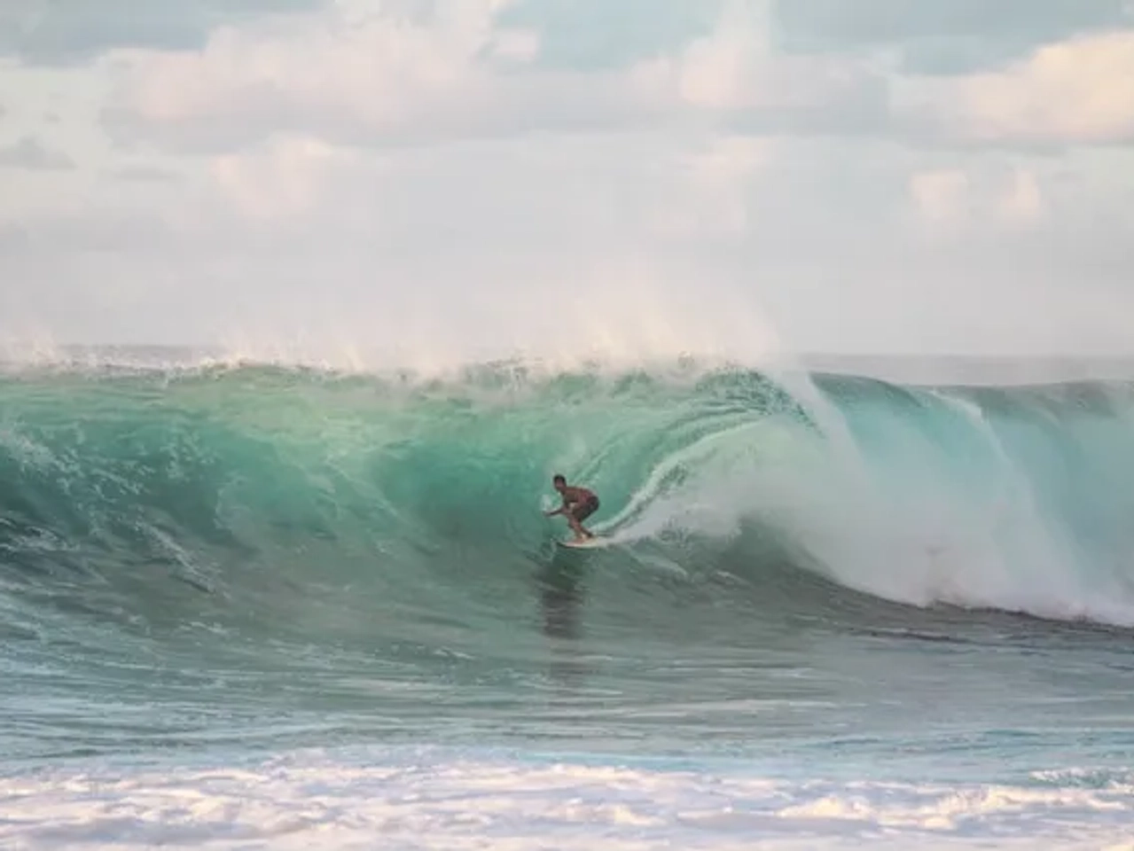 man surfing in Hanauma Bay in hawaii