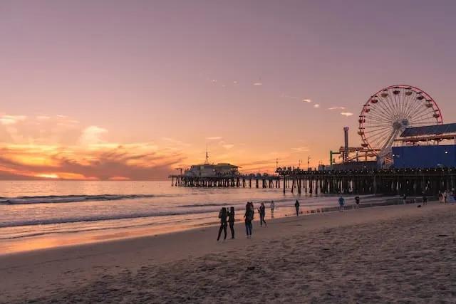people in santa monica at sunset in california, USA