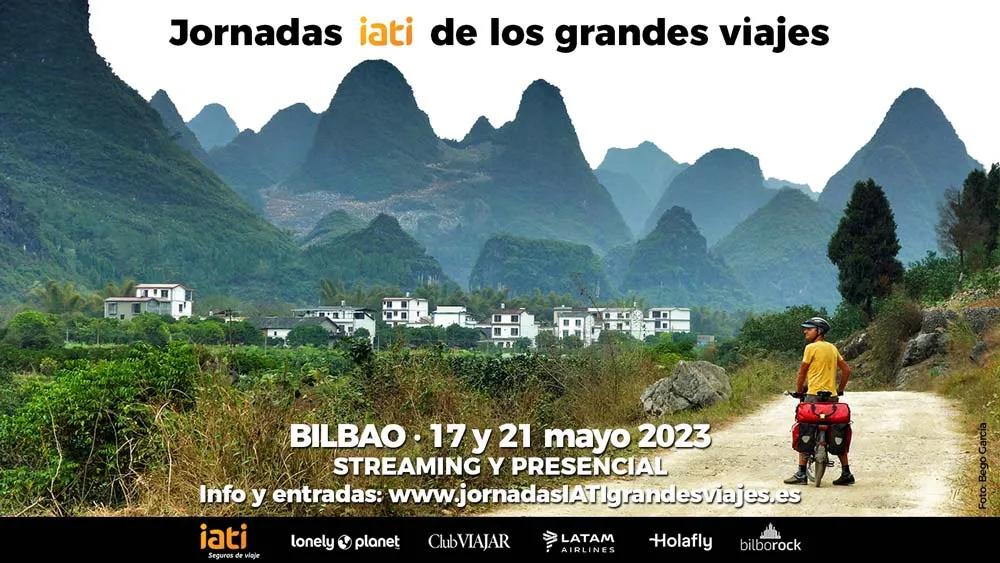Un ciclista en un paisaje montañoso, promocionando las Jornadas IATI en Bilbao.