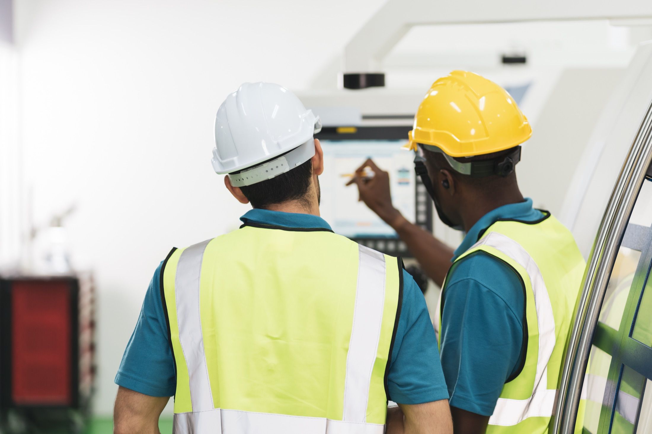 Industrial operators monitoring engineering systems