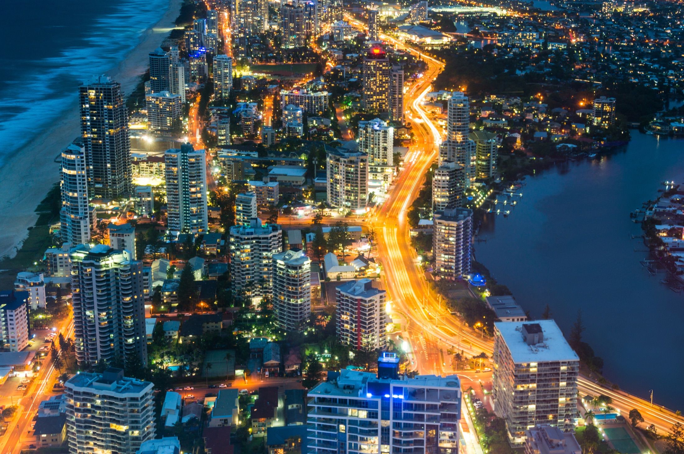 Night cityscape representing regional delivery and institutional scale