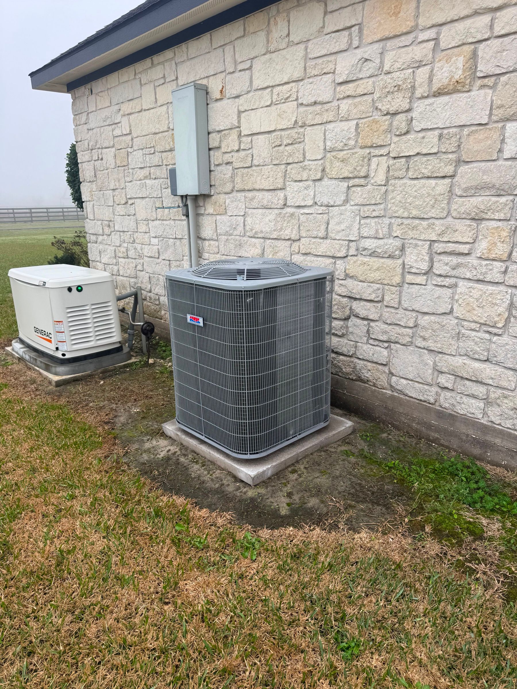 Residential condenser and standby generator installed at a Texas home