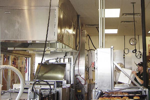 Commercial kitchen equipment and extraction hood